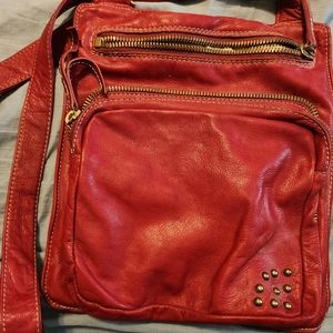 Red leather distressed cross over bag. Used, no wear or tear.